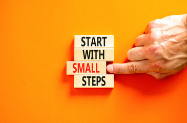 Start with small steps symbol. Concept words phrase Start with small steps on beautiful wooden...