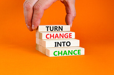 Turn change into chance symbol. Concept words phrase Turn change into chance on beautiful wooden...