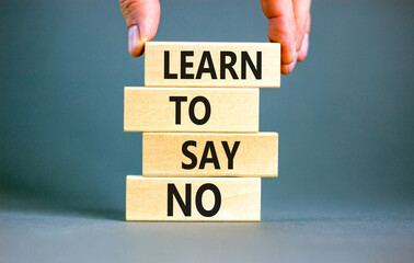 Learn to say no symbol. Concept words phrase Learn to say no on beautiful wooden blocks. Beautiful...