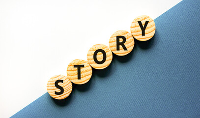 Story symbol. Concept word Story on beautiful wooden circles. Beautiful white and blue background. Business lifestyle story concept. Copy space.