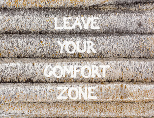 Leave your comfort zone symbol. Concept words Leave your comfort zone on beautiful grey stone wall. Beautiful stone wall background. Business psychological Leave your comfort zone concept. Copy space.