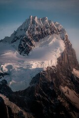 Majestic Snow-Covered Mountain Peak at Sunset