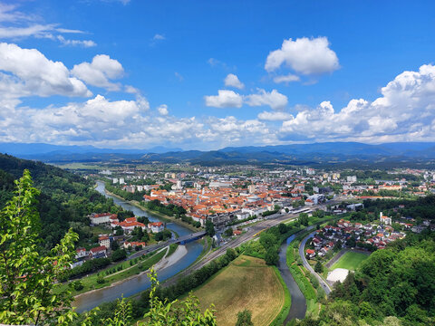 city Celje with rivers Savinja and Voglajna. Green landscape under blue sky. Slovenia