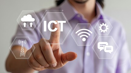 Person s finger touching the word ict surrounded by digital icons representing cloud computing wi fi communication and technology