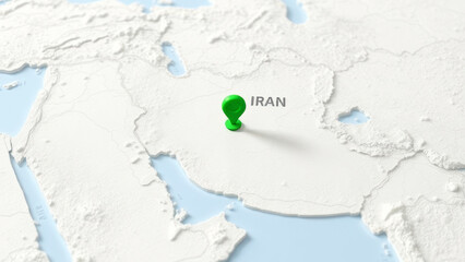 Green push pin marking Iran on a white and blue physical world map, providing a clear geographical representation of the country's location