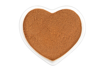 Cinnamon powder in ceramic bowl isolated on white background. Top view. Flat lay.