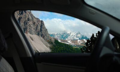 view from car window on snowy mountains alps car travel