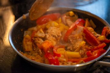 Macro Photo of Woman Cooking Chicken Sauté