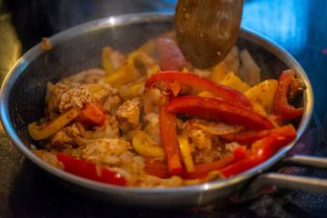 Macro Photo of Woman Cooking Chicken Sauté