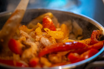 Macro Photo of Woman Cooking Chicken Sauté