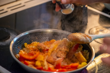 Macro Photo of Woman Cooking Chicken Sauté