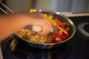Macro Photo of Woman Cooking Chicken Sauté