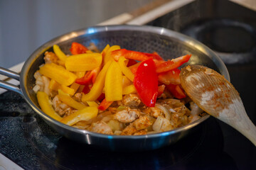 Macro Photo of Woman Cooking Chicken Sauté