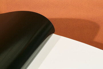 Open Hardcover Book on Brown Background
