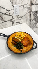 outhern Soul Food Skillet with Cornbread, Mac and Cheese, Collard Greens, Sweet Potatoes, and Fried Chicken