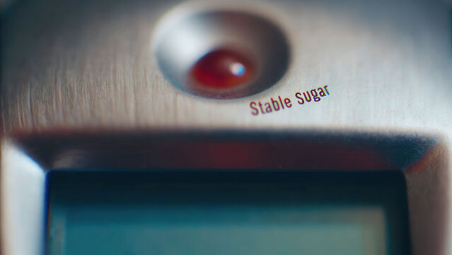 Stable sugar level on digital device display symbolizes health stability and monitoring in modern lifestyle