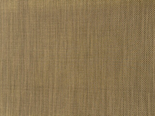 Natural textured background featuring woven fibers in earthy tones, creating a warm and inviting atmosphere for design and artistic applications