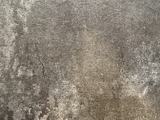 Natural textured background featuring rough gray stone surface with subtle variations, ideal for...