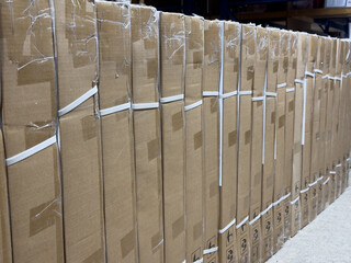 Osnabruck, Germany - June 22, 2025: Stacked cardboard boxes neatly arranged in a warehouse,...