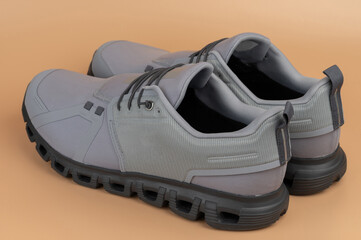 Stylish gray sneakers designed for comfort and performance during various activities