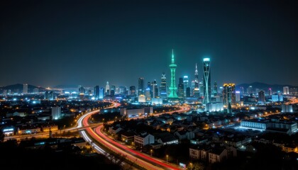 Fototapeta premium the image captures an extensive cityscape at night, illuminated by vibrant lights. several tall, modern structures dominate the skyline, including one that is green, creating a prominent focal point