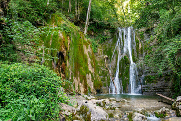Scenic view of the twin waterfalls in Faedis, located in the forested hills of northeastern Italy....