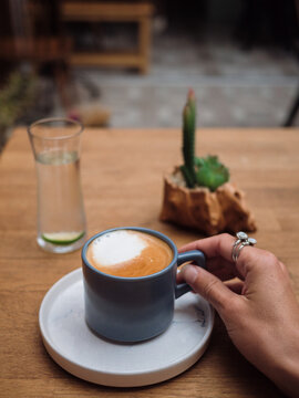 Closeup of a cappuccino coffee in a cup pov shot
