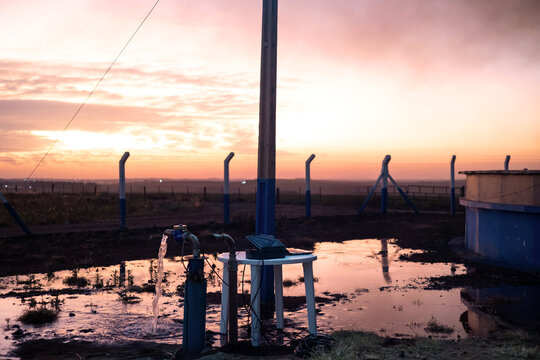 Water on the ground flowing from an artesian well