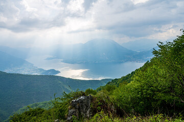 Varenna, Como Lake. Aerial panoramic view of town surrounded by mountains, blue sky and turquoise water and located in Como Lake, Lombardy, Italy