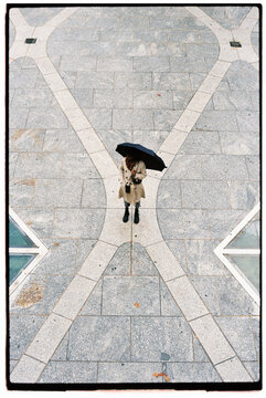 Woman standing at empty square