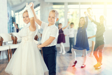 Classical dances performed by preteen children in beautiful festive clothes
