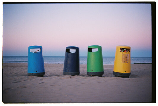 Colorful trash cans for sorting waste at beach