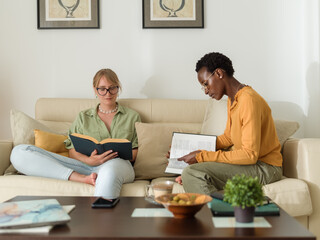 Focused women studying at home