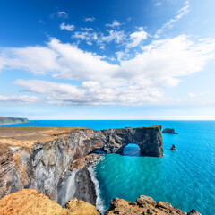 Impressive andscape with unique basalt arch on Dyrholaey Nature Reserve on Atlantic South Coast.
