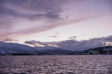 Industrial Town by Snowy Fjord at Twilight