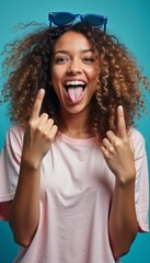 Joyful woman playfully sticking out her tongue