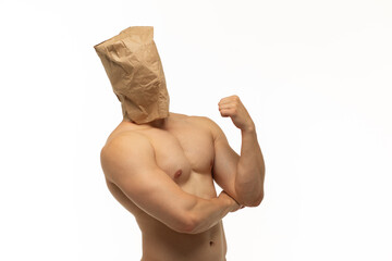 young guy with athletic and smooth body with paper bag without pictures and inscriptions on his...