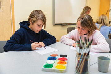 Kids Painting in the Classroom