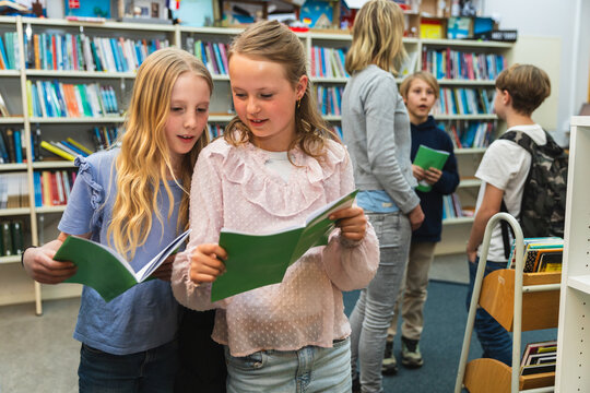 Children Reading Together in a School Library