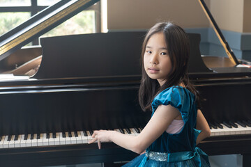 Portrait of a Young Pianist in A Blue Dress