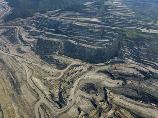 An aerial view of a large coal quarry.