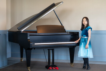 Portrait of a Young Pianist in A Blue Dress