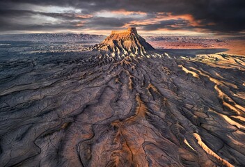 Drone picture Factory Butte wide anlge at sunset against colorful sky. Hanksville. Utah. USA