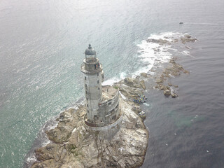 An old abandoned lighthouse from a close view.