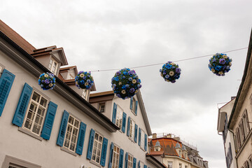 Konstanz, Germany- May 28, 2025: Konstanz old town (altstadt) flower balls colorful decorations...