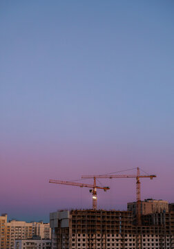 Tower Cranes and High-Rise Construction at Dusk