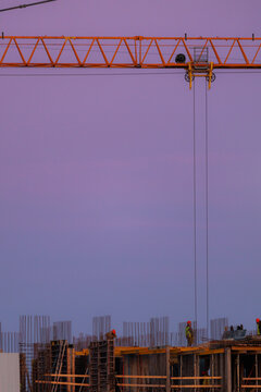 Minimalist Yellow Tower Crane at Construction Site