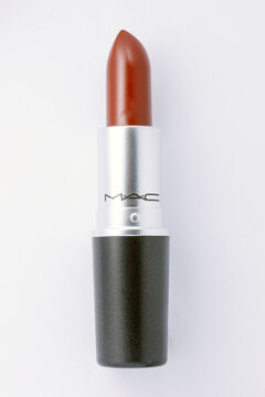 01.07.2020. Lubliniec, Poland. Red MAC lipstick in classic black and silver packaging isolated on white background, beauty product photography for cosmetics, makeup branding and modern feminine style