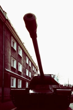 Tank Silhouette Against Building