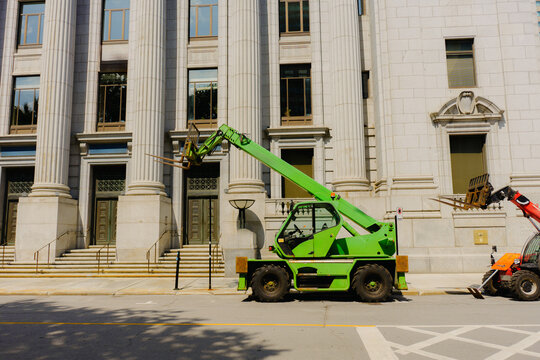 Machinery working near old government building in downtown Montreal